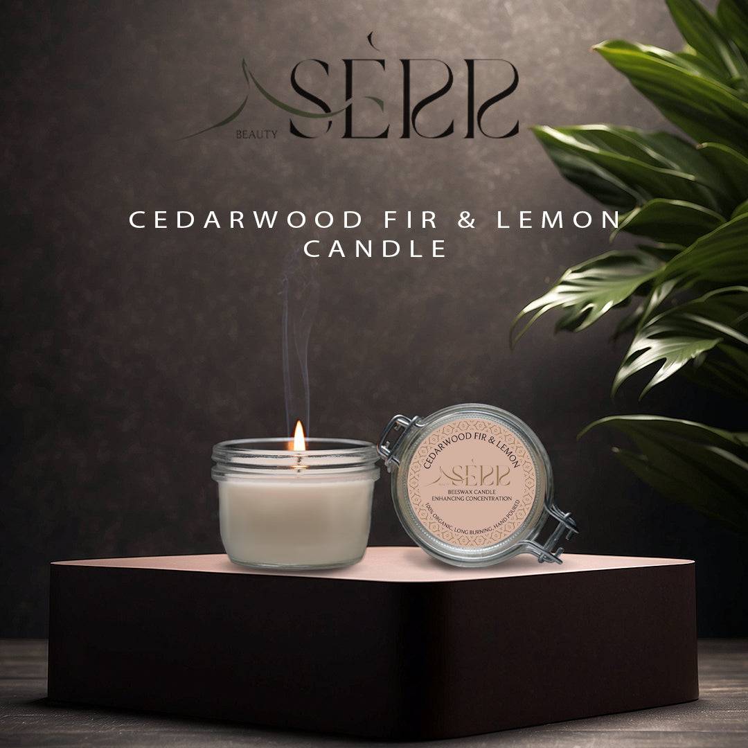 SerrBeauty Cedarwood, Fir & Lemon Beeswax Scented Candle in a glass jar with a lit wick, placed on a dark pedestal. The organic beeswax candle emits a soothing aroma with woodsy and citrus notes, perfect for home wellness and aromatherapy.