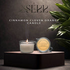 SerrBeauty Cinnamon, Clove & Orange Beeswax Scented Candle 125 G in a glass jar with a metal lid. Handcrafted with organic beeswax, this candle emits warm, spicy, and citrusy aromas, perfect for a cozy ambiance.