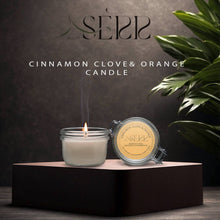 SerrBeauty Cinnamon, Clove & Orange Beeswax Scented Candle 125 G in a glass jar with a metal lid. Handcrafted with organic beeswax, this candle emits warm, spicy, and citrusy aromas, perfect for a cozy ambiance.