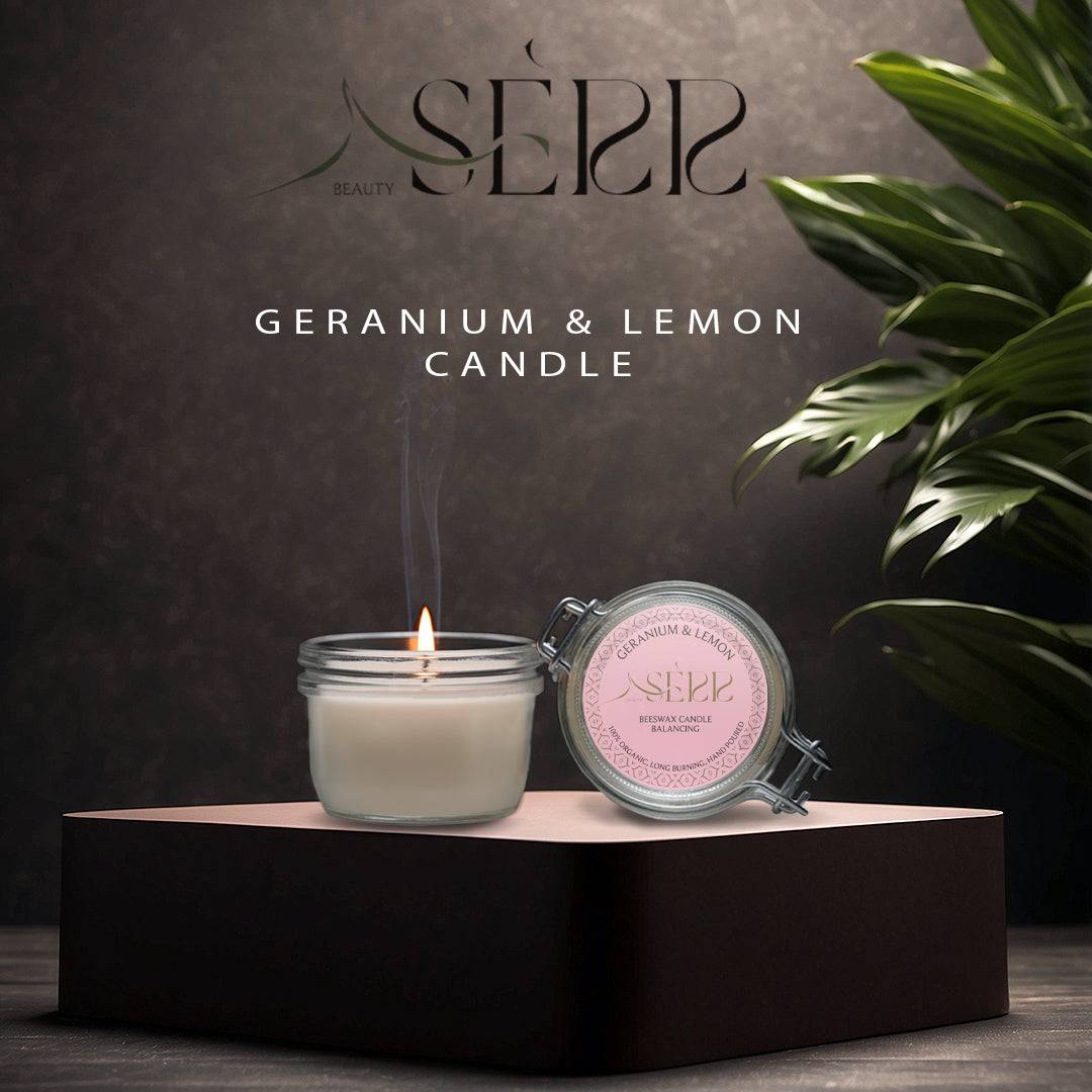 SerrBeauty Geranium & Lemon Beeswax Scented Candle 125 G in a glass jar with a lit wick, placed on an elegant black platform. Handcrafted with organic beeswax and infused with essential oils for a refreshing floral-citrus aroma.