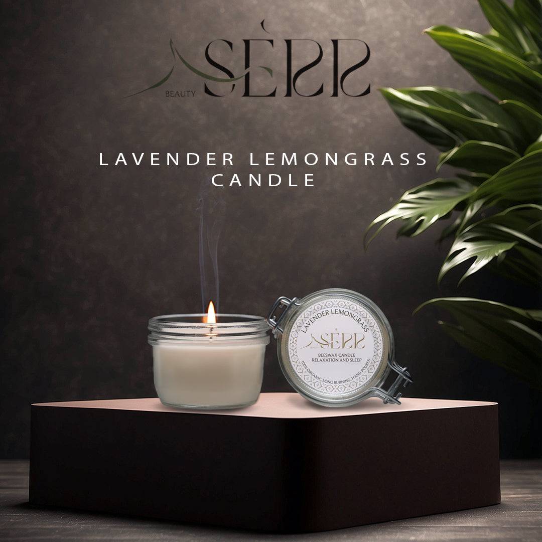 SerrBeauty Lavender & Lemongrass Beeswax Scented Candle 125 G in a glass jar with a metal lid, placed on an elegant black platform. The organic beeswax candle emits a calming aroma, blending floral lavender and citrusy lemongrass for relaxation and energy.