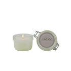 SerrBeauty Cedarwood, Fir & Lemon Beeswax Scented Candle 125 G in a glass jar with a lit wick. Organic beeswax candle with a refreshing woodsy citrus aroma.