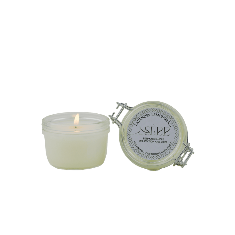SerrBeauty Lavender & Lemongrass Beeswax Scented Candle 125 G in a glass jar with a secure lid. Handcrafted from organic beeswax, this candle offers a calming lavender and invigorating lemongrass aroma for relaxation and energy.
