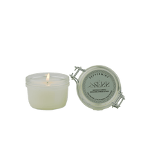 SerrBeauty Peppermint Beeswax Scented Candle 125 G in a glass jar with a lit wick, releasing a refreshing peppermint aroma. Made from organic beeswax for a calming and eco-friendly home fragrance experience.