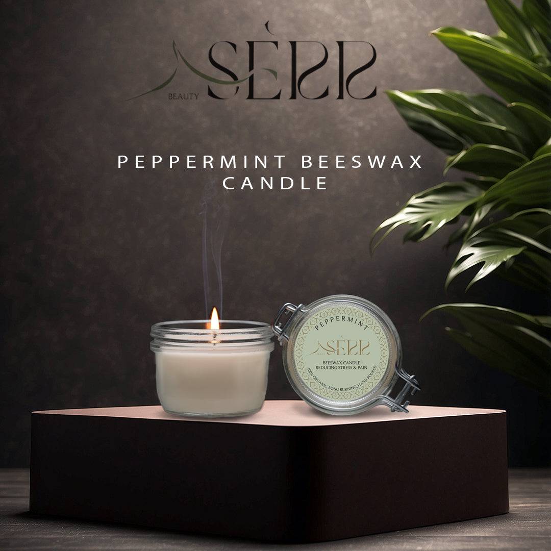 SerrBeauty Peppermint Beeswax Scented Candle 125 G in a glass jar with a lit wick, placed on an elegant black platform. Made from organic beeswax and infused with pure peppermint essential oil for a refreshing and calming aroma.