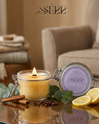 SerrBeauty eucalyptus, cinnamon, clove and lemon beeswax candle 125g burning in a glass jar with natural styling