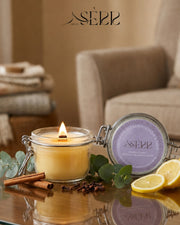 SerrBeauty eucalyptus, cinnamon, clove and lemon beeswax candle 125g burning in a glass jar with natural styling