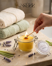 SerrBeauty lavender and lemongrass beeswax candle 125g burning in a glass jar with calm natural styling
