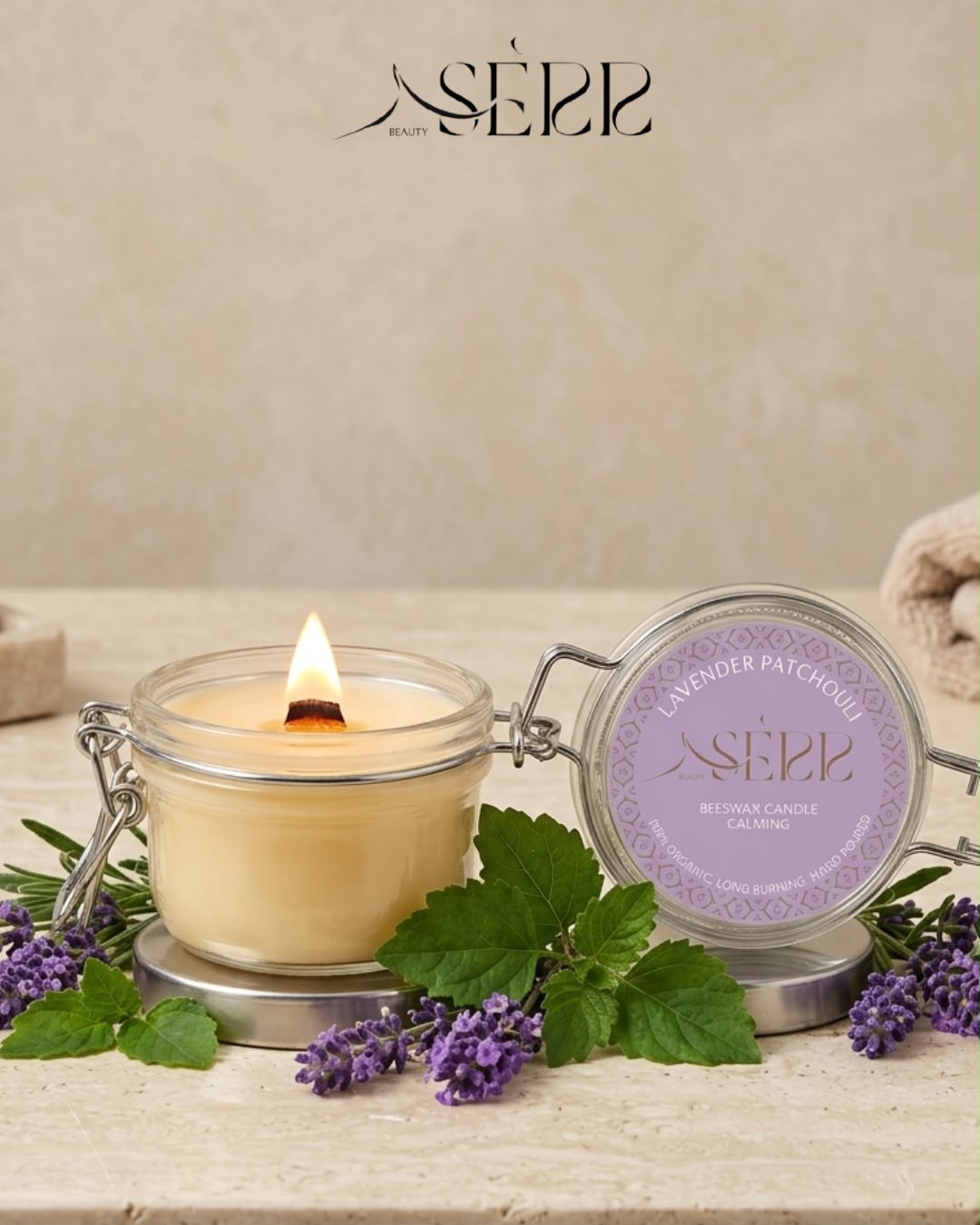 SerrBeauty lavender and patchouli beeswax candle 125g burning in a glass jar with natural lavender styling