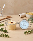 Serenity Spirit beeswax candle 125g burning in a glass jar with natural styling