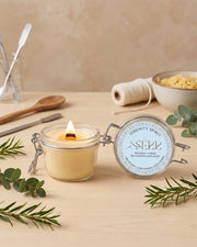 Serenity Spirit beeswax candle 125g burning in a glass jar with natural styling