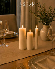SerrBeauty everyday rapeseed wax pillar candles styled on a dining table