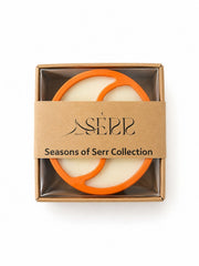 Top view of Seasons of Serr candle with label and packaging