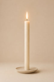 Everyday unscented rapeseed wax pillar candle 25g burning on a ceramic plate