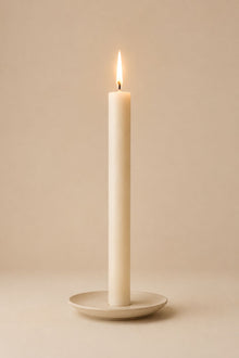 Everyday unscented rapeseed wax pillar candle 25g burning on a ceramic plate