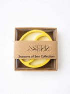 Top view of Seasons of Serr candle with label and packaging
