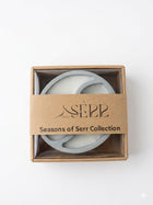 Top view of Seasons of Serr candle with label and packaging
