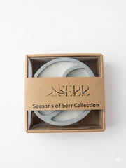 Top view of Seasons of Serr candle with label and packaging